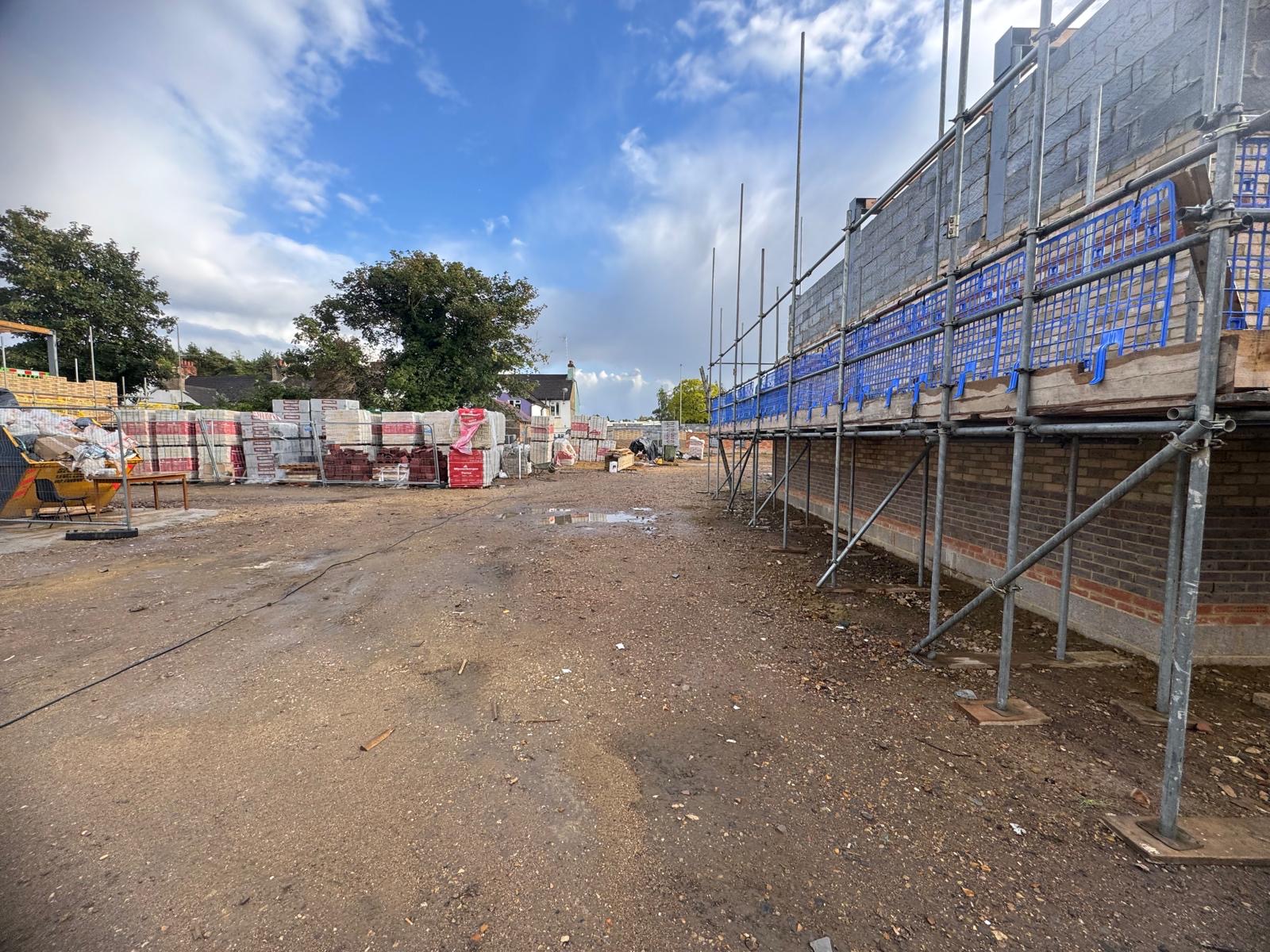 Brickwork rising ground floor block and brick scaffold erected